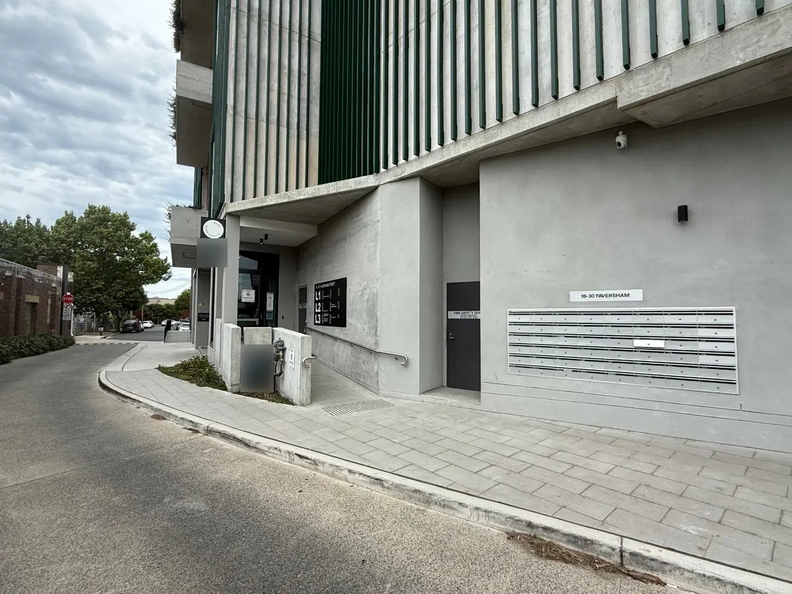 Entrance to 18–30 Faversham Street, Marrickville, with the Made Marrickville sign and the ramp