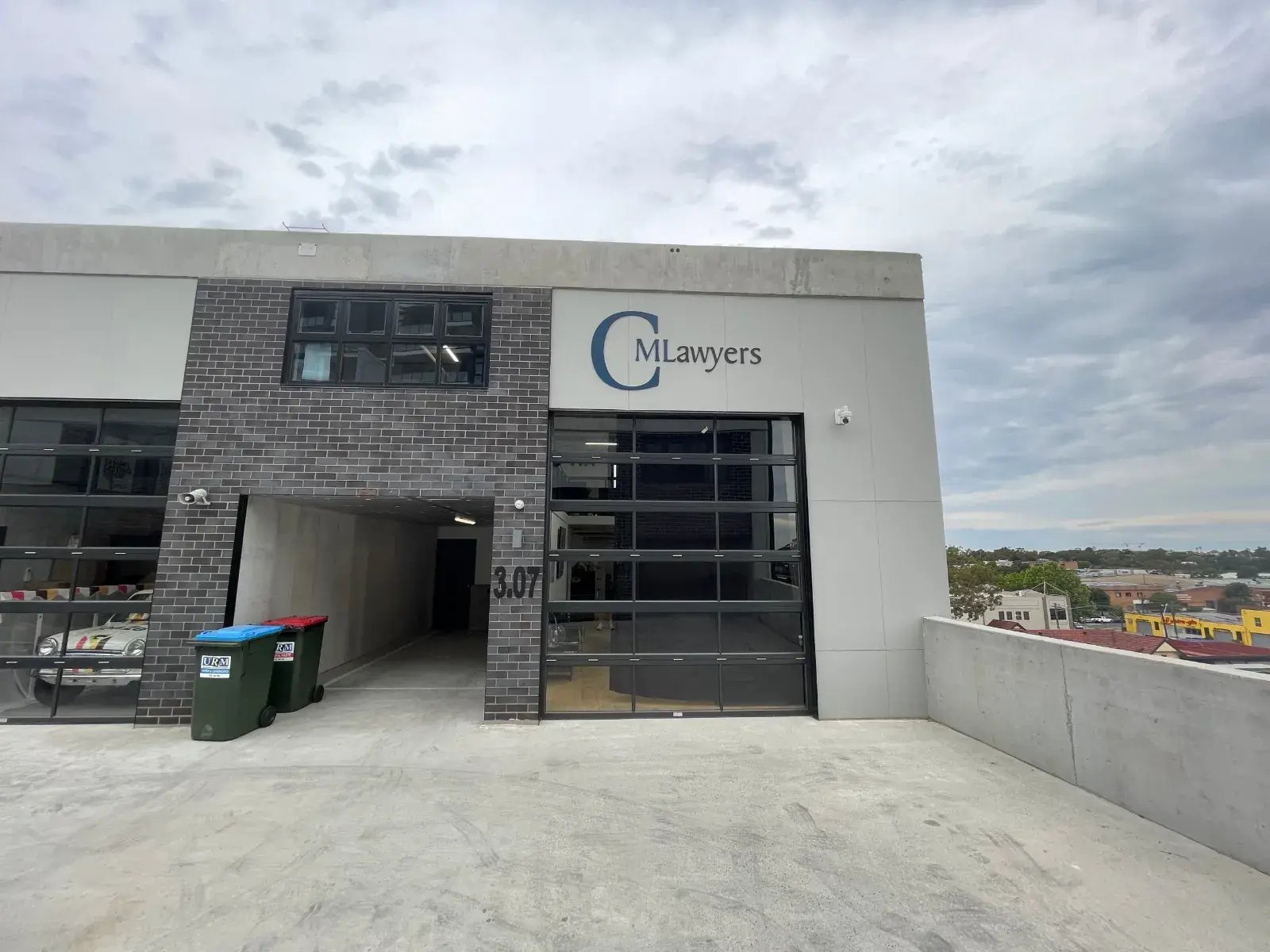 CM Lawyers office, Unit 3.07, with the CM Lawyers sign above the glass door