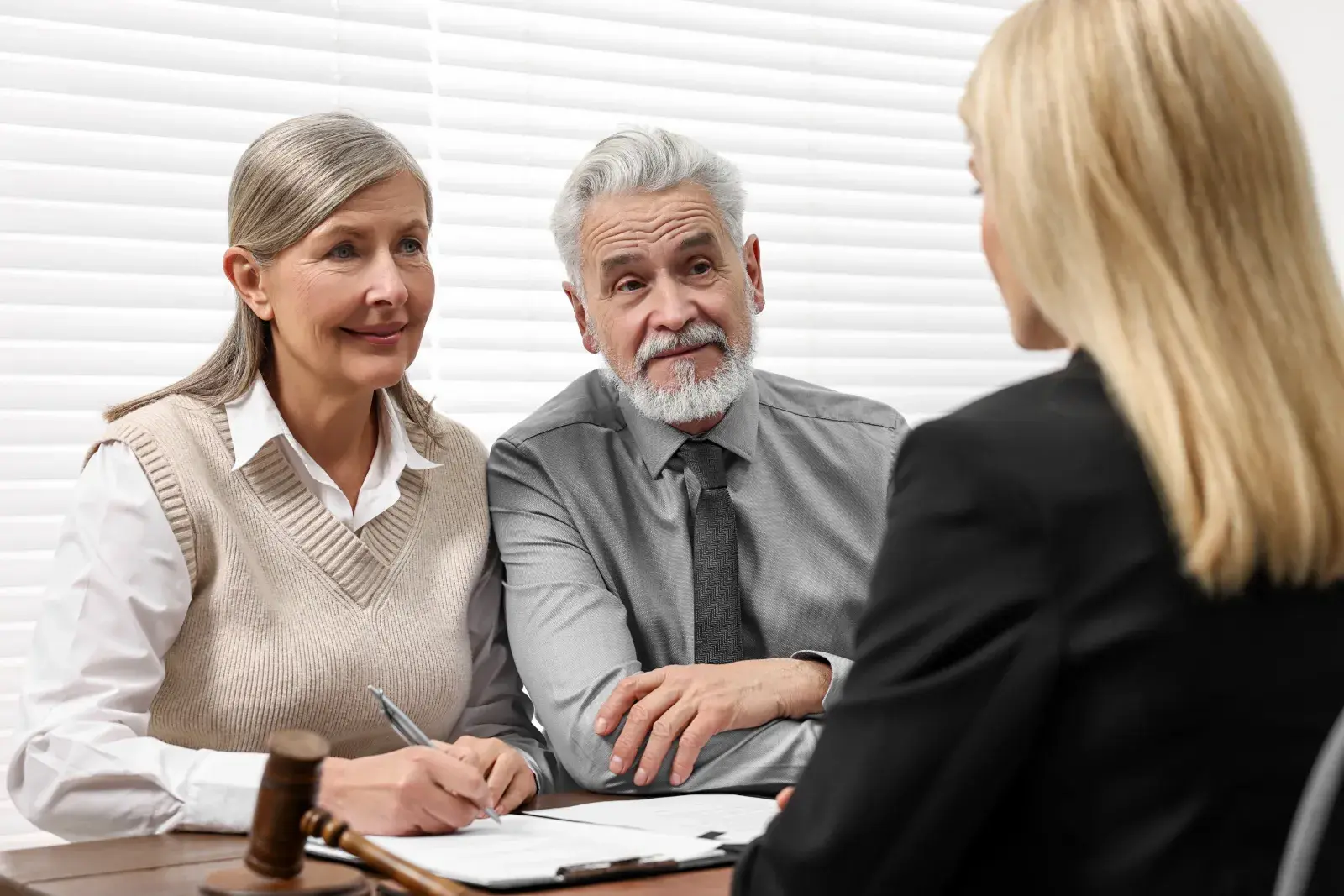 Older couple meeting a solicitor about their wills